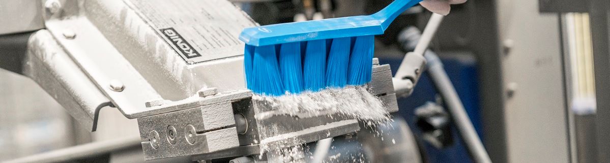 Vikan blauwe borstel op machine